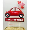 Cheap Carls Red Car w/Love You More sign on Two Poles